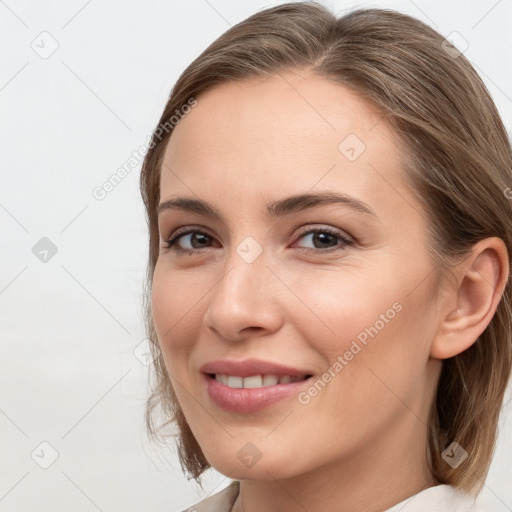 Joyful white young-adult female with medium  brown hair and grey eyes