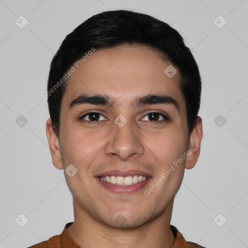 Joyful white young-adult male with short  black hair and brown eyes