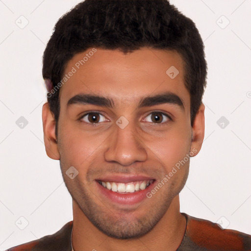 Joyful white young-adult male with short  black hair and brown eyes