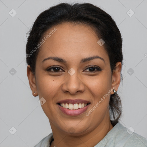 Joyful latino young-adult female with medium  brown hair and brown eyes