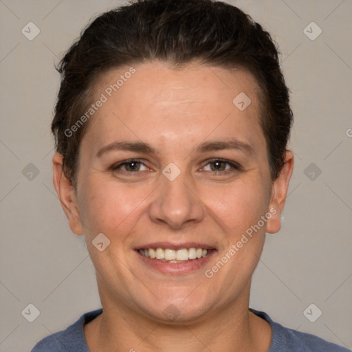 Joyful white adult female with short  brown hair and brown eyes