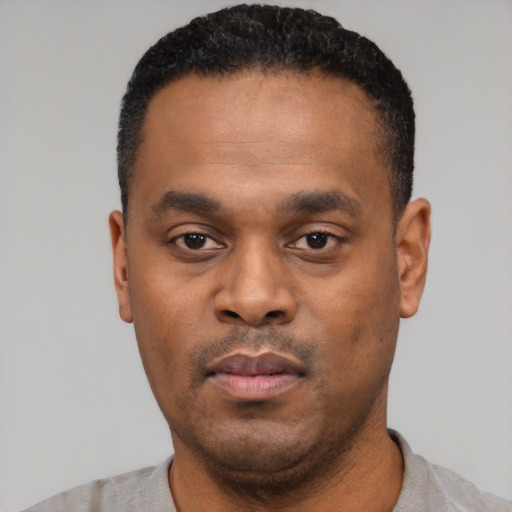 Neutral black young-adult male with short  black hair and brown eyes