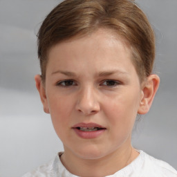 Joyful white child female with short  brown hair and brown eyes