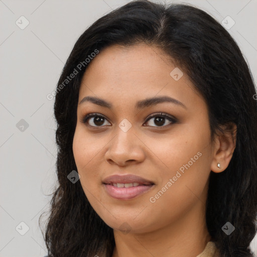 Joyful latino young-adult female with long  brown hair and brown eyes