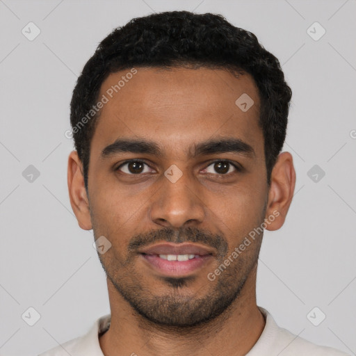 Joyful latino young-adult male with short  black hair and brown eyes