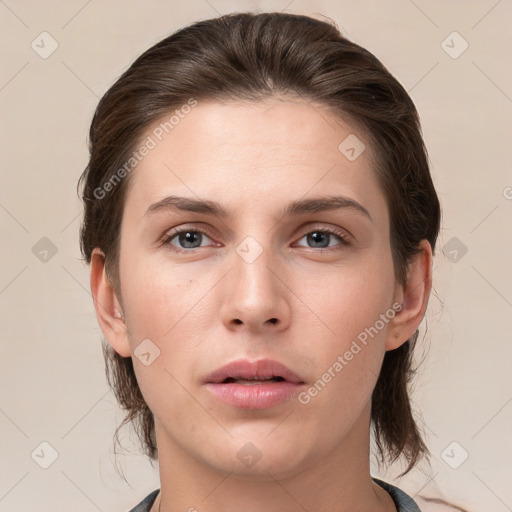 Neutral white young-adult female with medium  brown hair and brown eyes