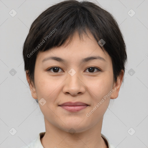 Joyful asian young-adult female with short  brown hair and brown eyes