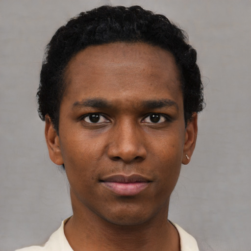 Neutral black young-adult male with short  black hair and brown eyes