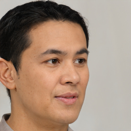 Neutral white adult male with short  black hair and brown eyes
