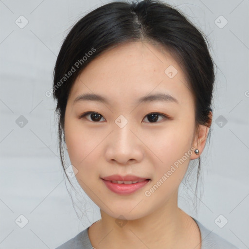 Joyful asian young-adult female with medium  black hair and brown eyes