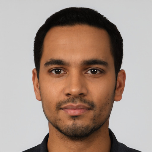 Neutral latino young-adult male with short  black hair and brown eyes