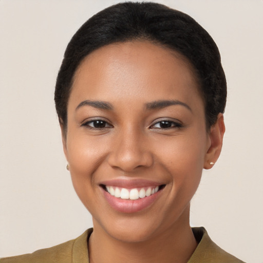 Joyful latino young-adult female with short  brown hair and brown eyes