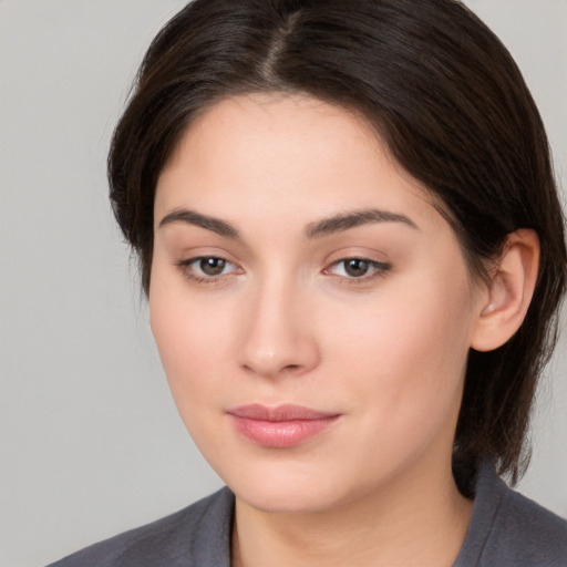 Neutral white young-adult female with medium  brown hair and brown eyes