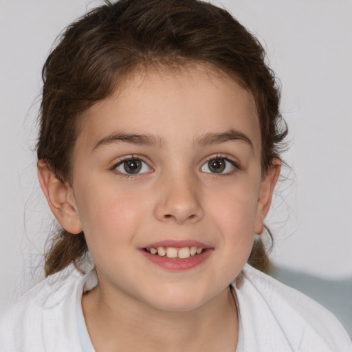 Joyful white child female with medium  brown hair and brown eyes