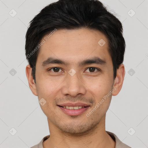 Joyful white young-adult male with short  black hair and brown eyes