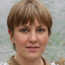 Joyful white adult female with medium  brown hair and grey eyes