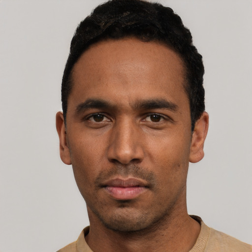 Neutral black young-adult male with short  black hair and brown eyes
