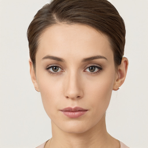 Neutral white young-adult female with short  brown hair and brown eyes