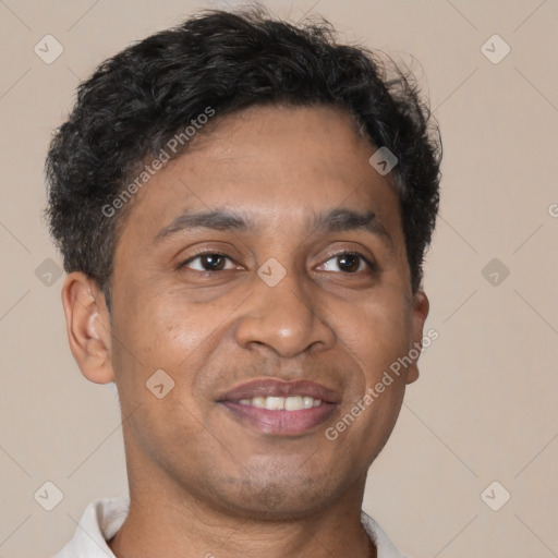 Joyful black young-adult male with short  brown hair and brown eyes