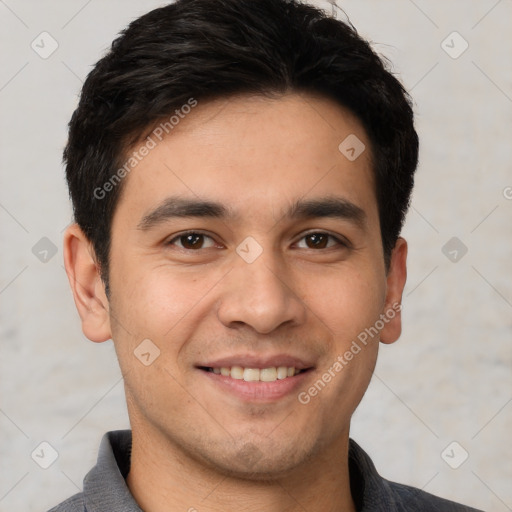 Joyful white young-adult male with short  black hair and brown eyes