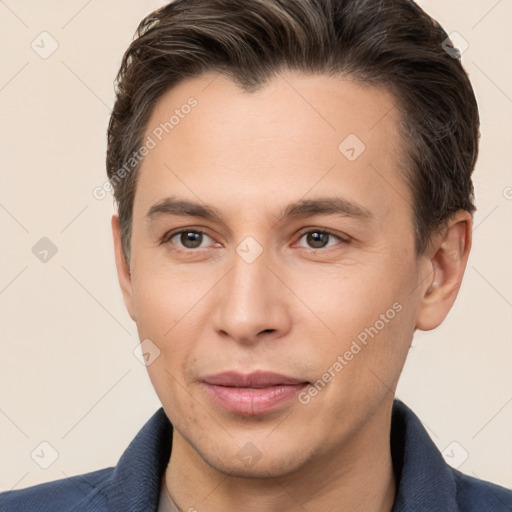 Joyful white young-adult male with short  brown hair and brown eyes