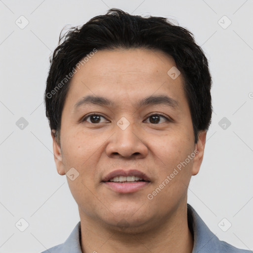 Joyful white young-adult male with short  black hair and brown eyes