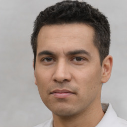 Neutral white young-adult male with short  black hair and brown eyes