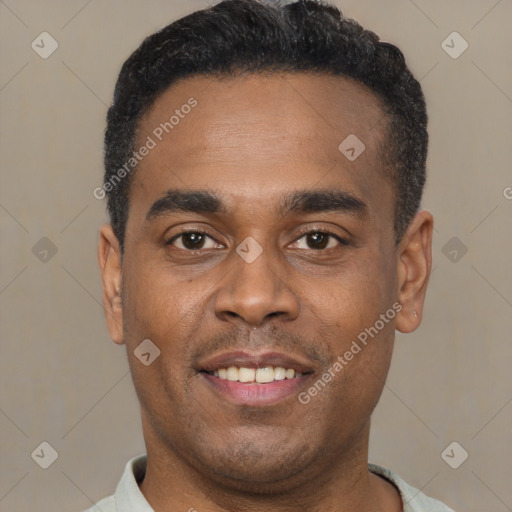 Joyful latino young-adult male with short  black hair and brown eyes