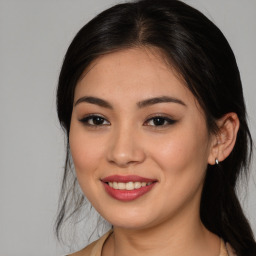 Joyful white young-adult female with medium  brown hair and brown eyes