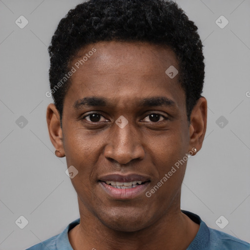 Joyful black young-adult male with short  black hair and brown eyes