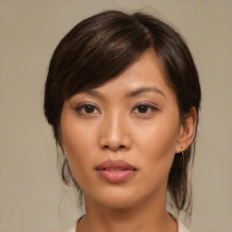 Neutral asian young-adult female with medium  brown hair and brown eyes