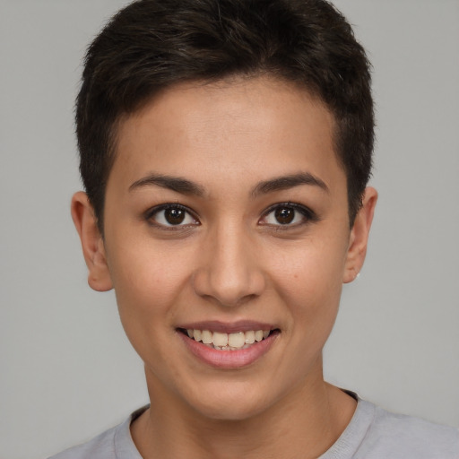 Joyful white young-adult female with short  brown hair and brown eyes