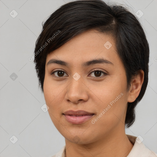 Joyful asian young-adult female with short  brown hair and brown eyes