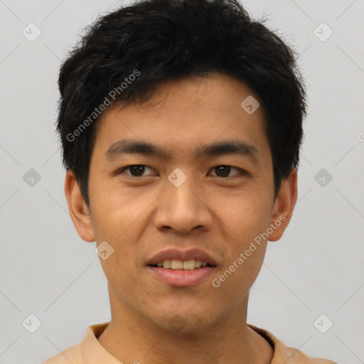 Joyful asian young-adult male with short  black hair and brown eyes