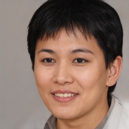 Joyful asian young-adult female with short  brown hair and brown eyes