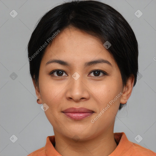 Joyful asian young-adult female with short  black hair and brown eyes