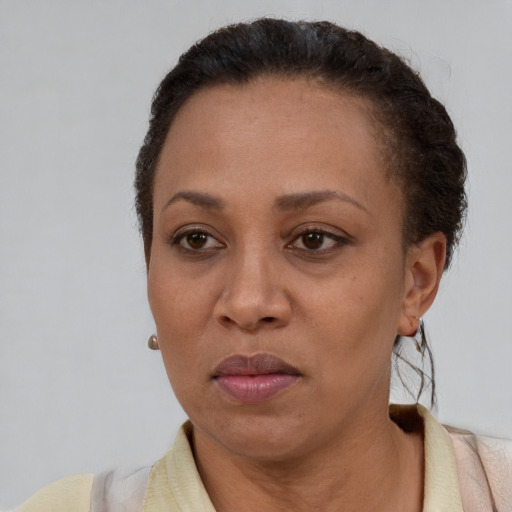 Neutral black adult female with short  brown hair and brown eyes