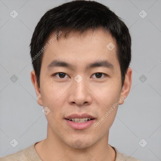 Joyful asian young-adult male with short  brown hair and brown eyes