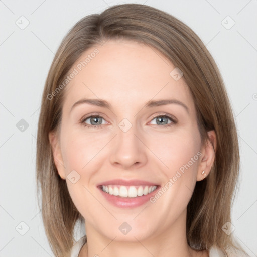 Joyful white young-adult female with medium  brown hair and grey eyes