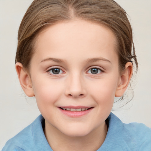 Joyful white child female with medium  brown hair and blue eyes