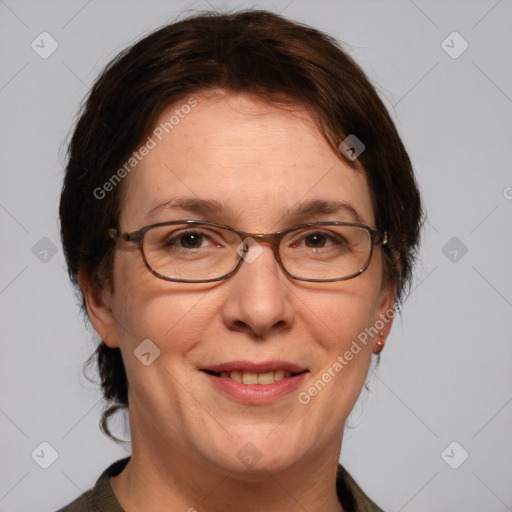Joyful white adult female with medium  brown hair and grey eyes