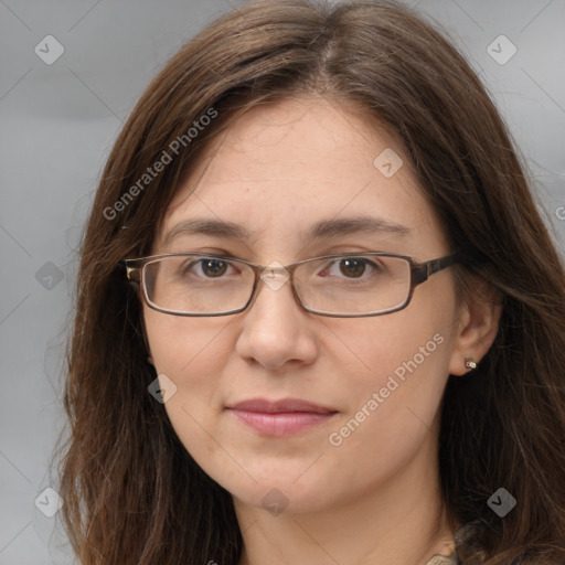 Joyful white adult female with long  brown hair and grey eyes