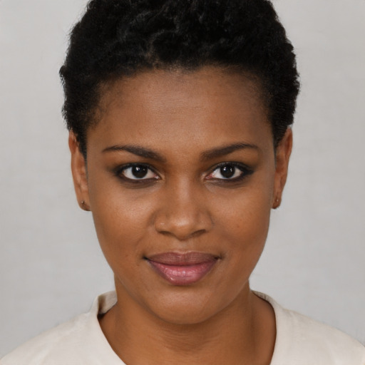 Joyful black young-adult female with short  brown hair and brown eyes