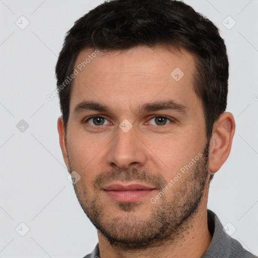 Joyful white young-adult male with short  brown hair and brown eyes