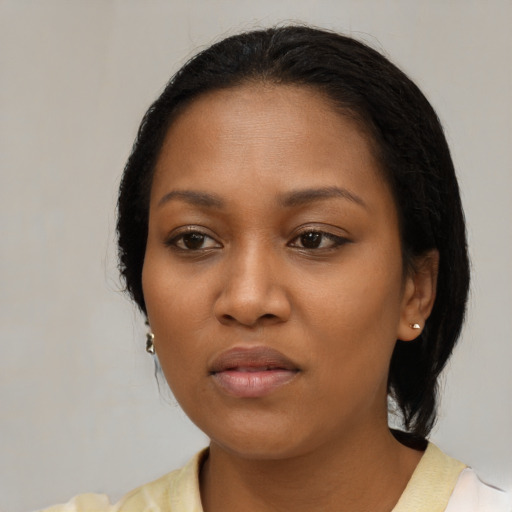 Neutral black young-adult female with medium  black hair and brown eyes