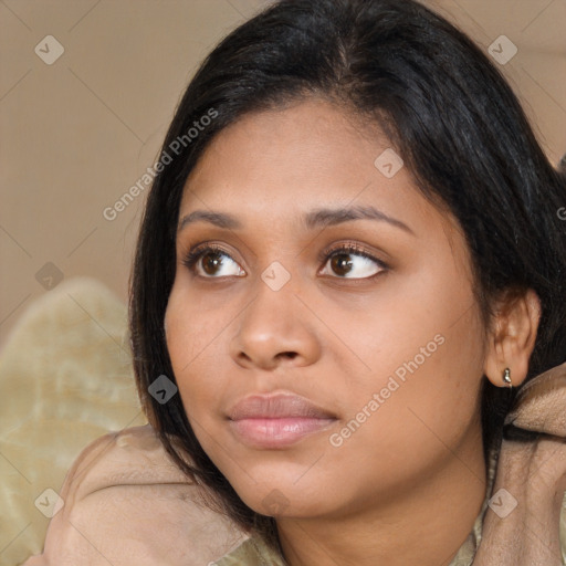 Joyful asian young-adult female with medium  brown hair and brown eyes