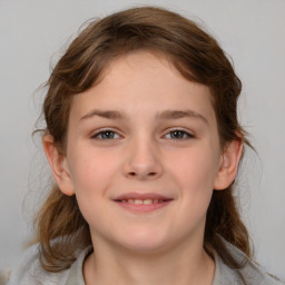 Joyful white child female with medium  brown hair and brown eyes