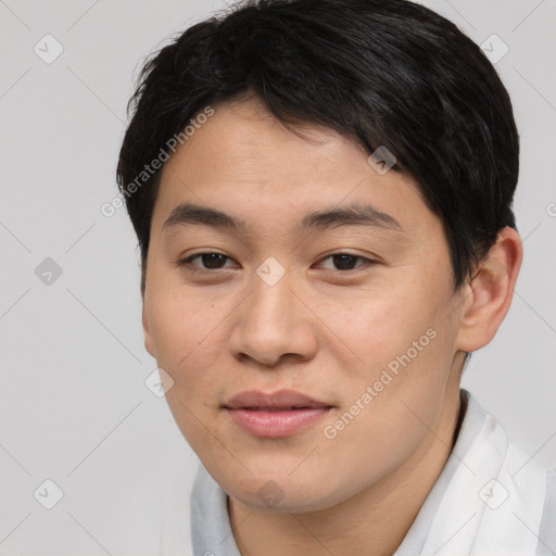 Joyful asian young-adult male with short  brown hair and brown eyes