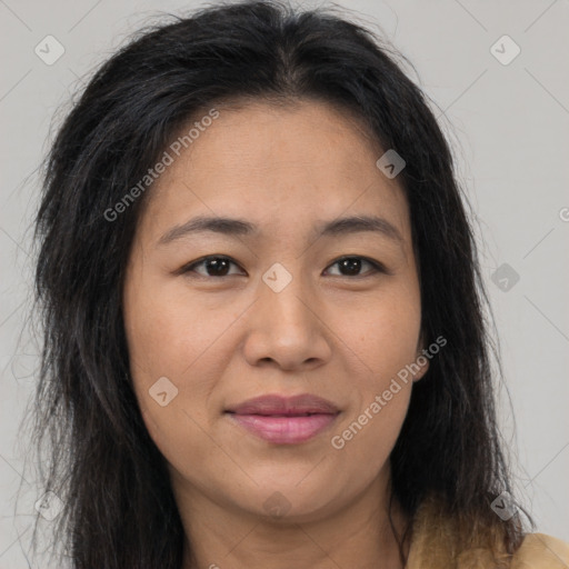 Joyful asian young-adult female with long  brown hair and brown eyes