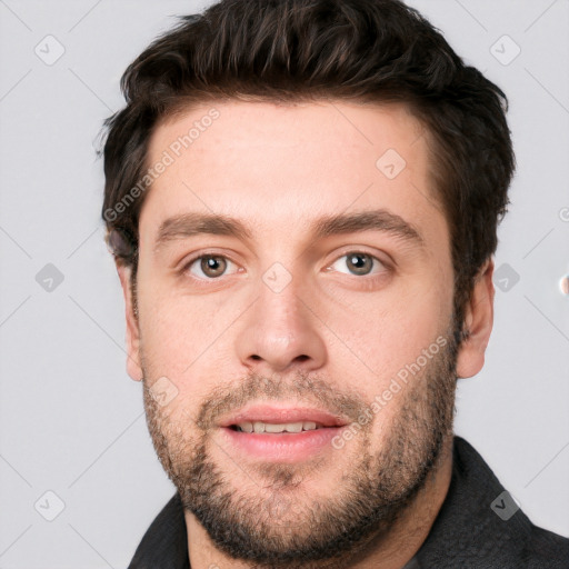 Joyful white adult male with short  brown hair and grey eyes